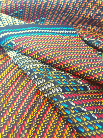 African Fabrics By the Yard - Kitenge - Basket Weaving Pattern. Red, Black, Blue, White, Yellow, and Orange